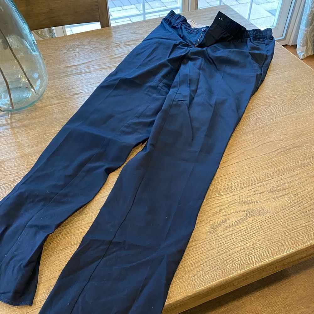 14 Husky. Brand new! Lands end - raw hem. Navy uniform pants.
